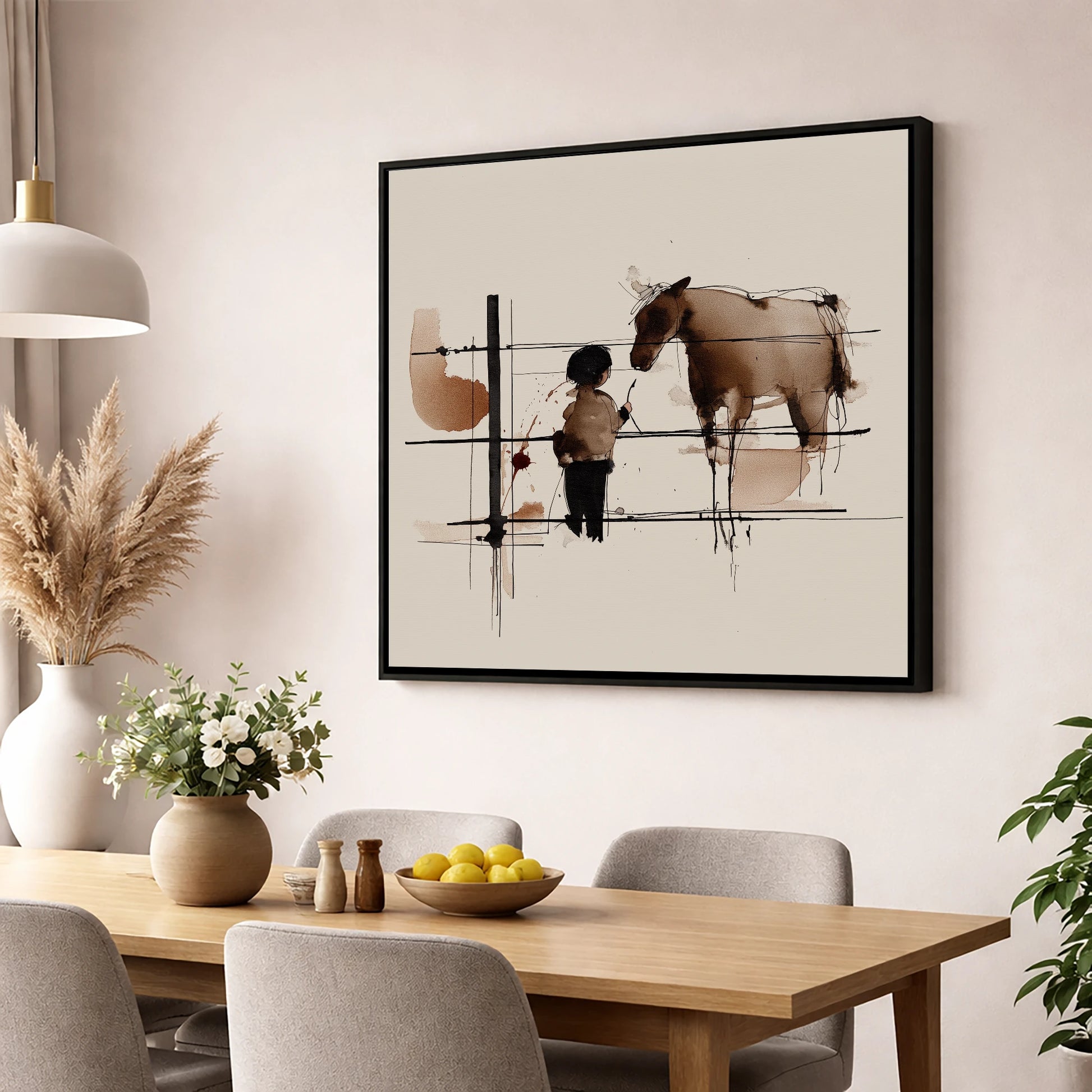 A Quiet Connection horse & rider wall art displayed in a dining room