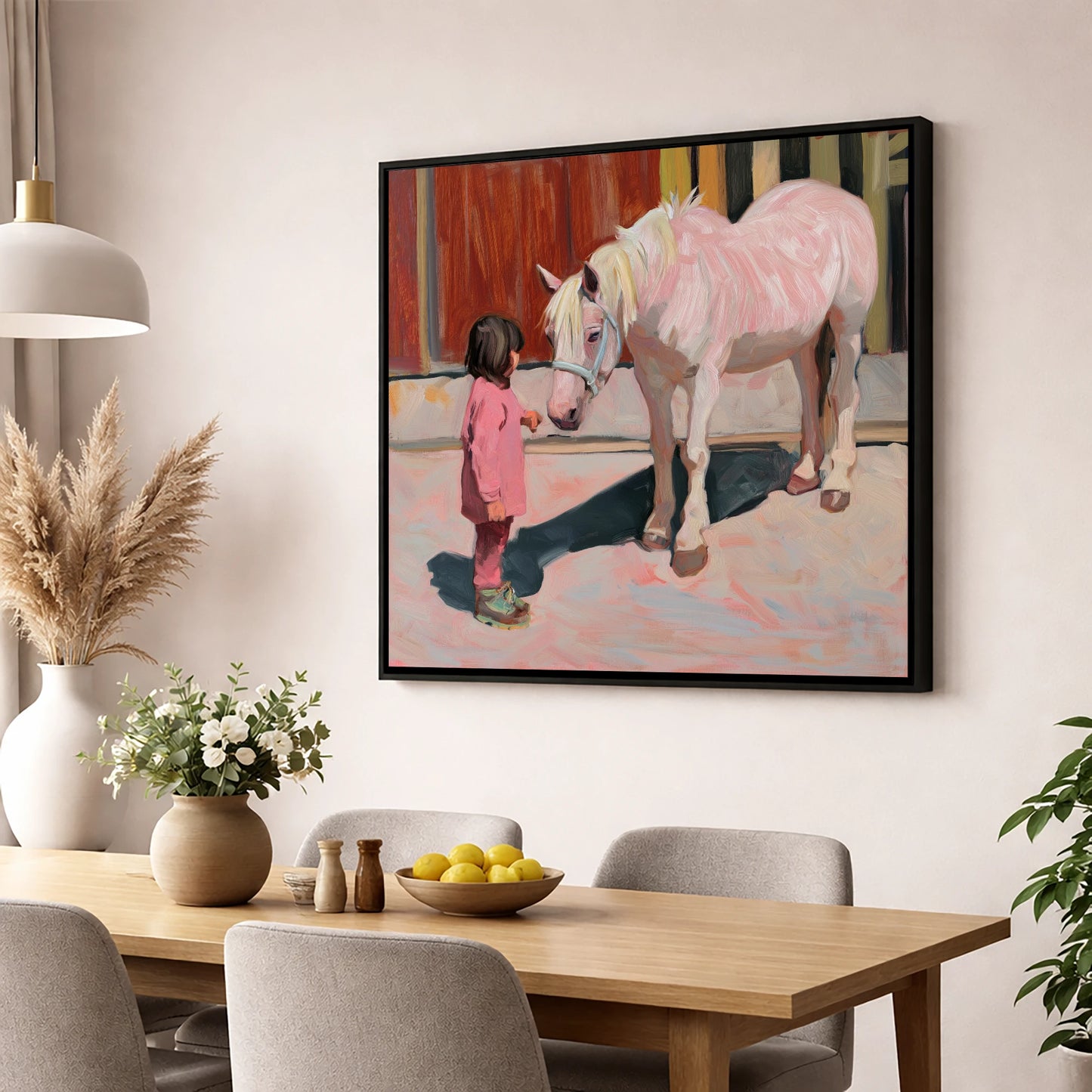 A Quiet Connection horse & rider wall art displayed in a dining room