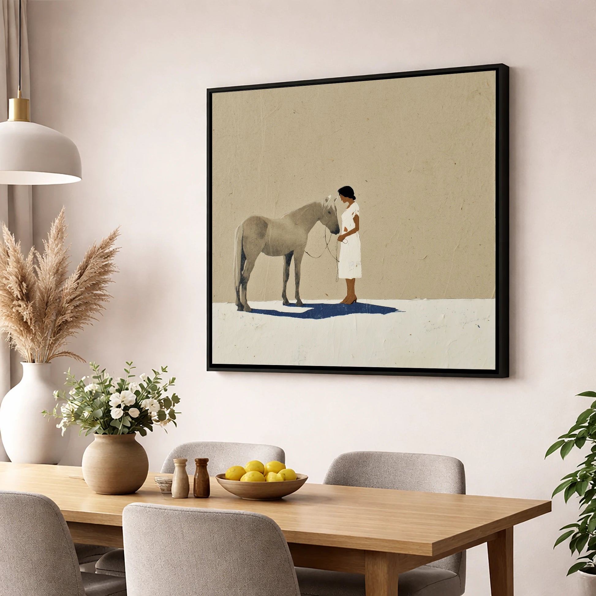 The Quiet Exchange horse & rider wall art displayed in a dining room