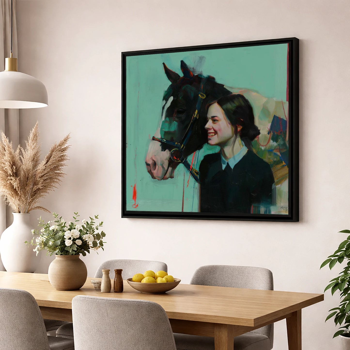 A Shared Understanding horse & rider wall art displayed in a dining room