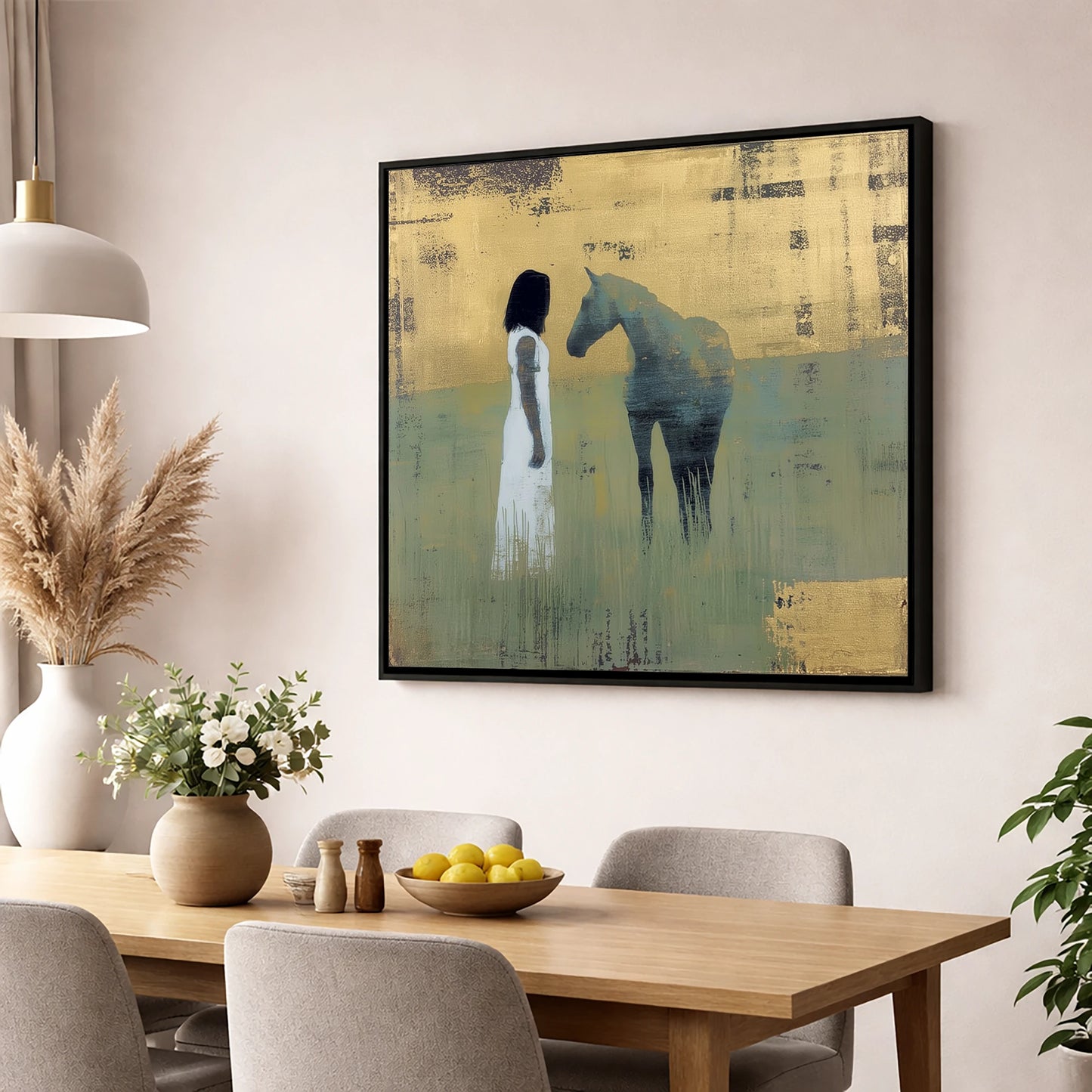 A Quiet Connection horse & rider wall art displayed in a dining room