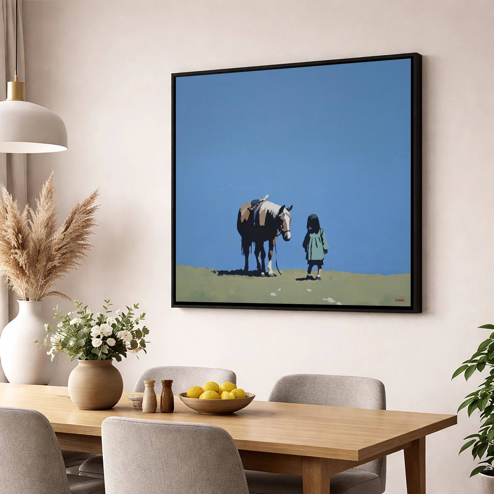 A Quiet Understanding horse & rider wall art displayed in a dining room