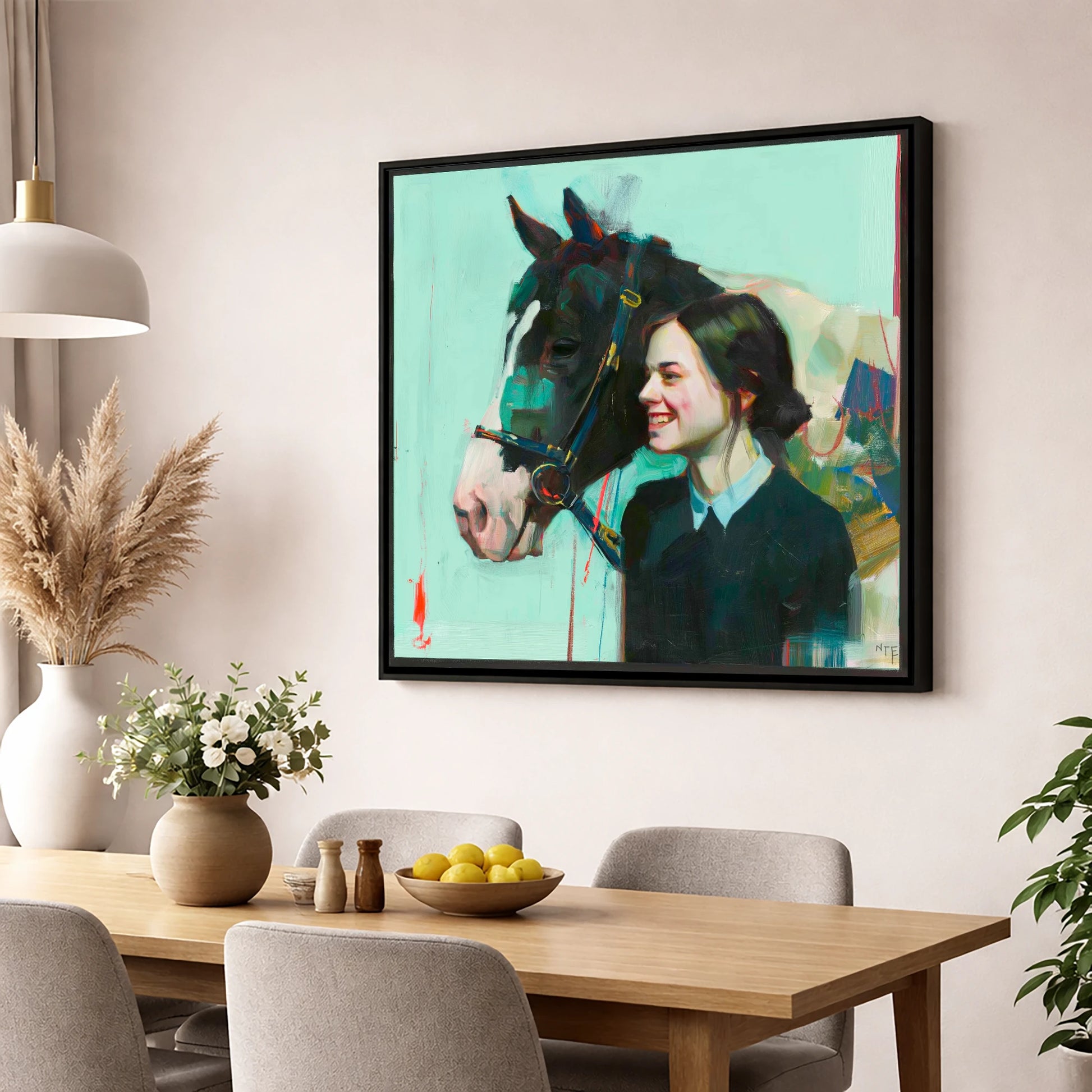 A Shared Understanding horse & rider wall art displayed in a dining room