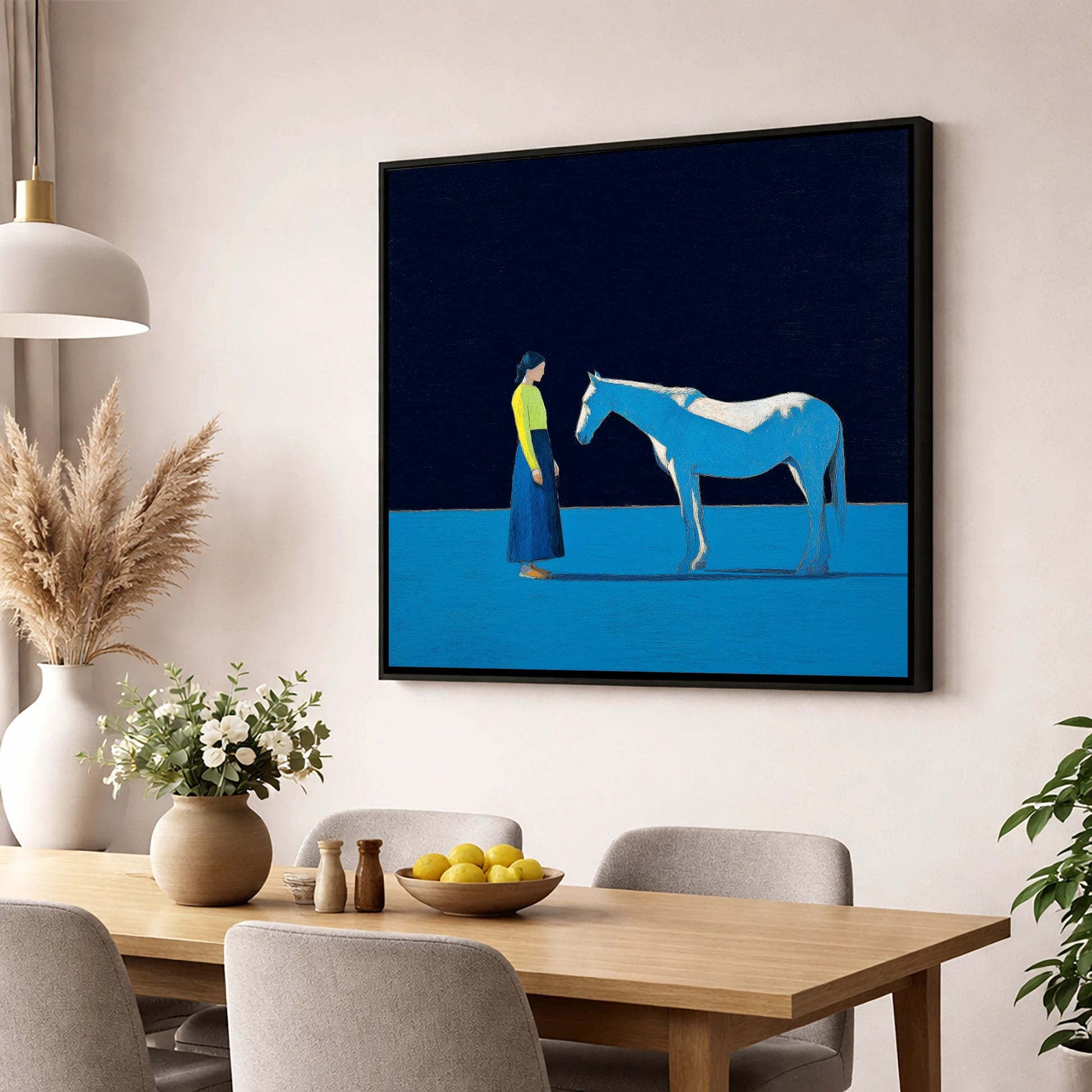 A Quiet Connection horse & rider wall art displayed in a dining room