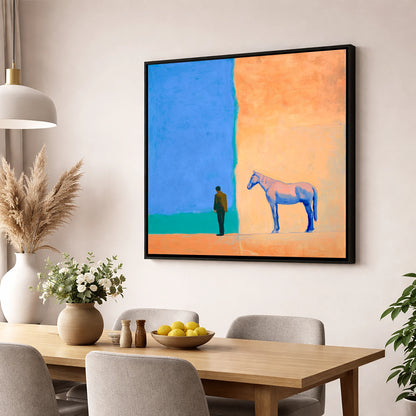 Between Blue and Sand horse & rider wall art displayed in a dining room