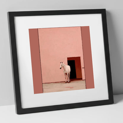 The Pink Courtyard horse stable art print in black frame