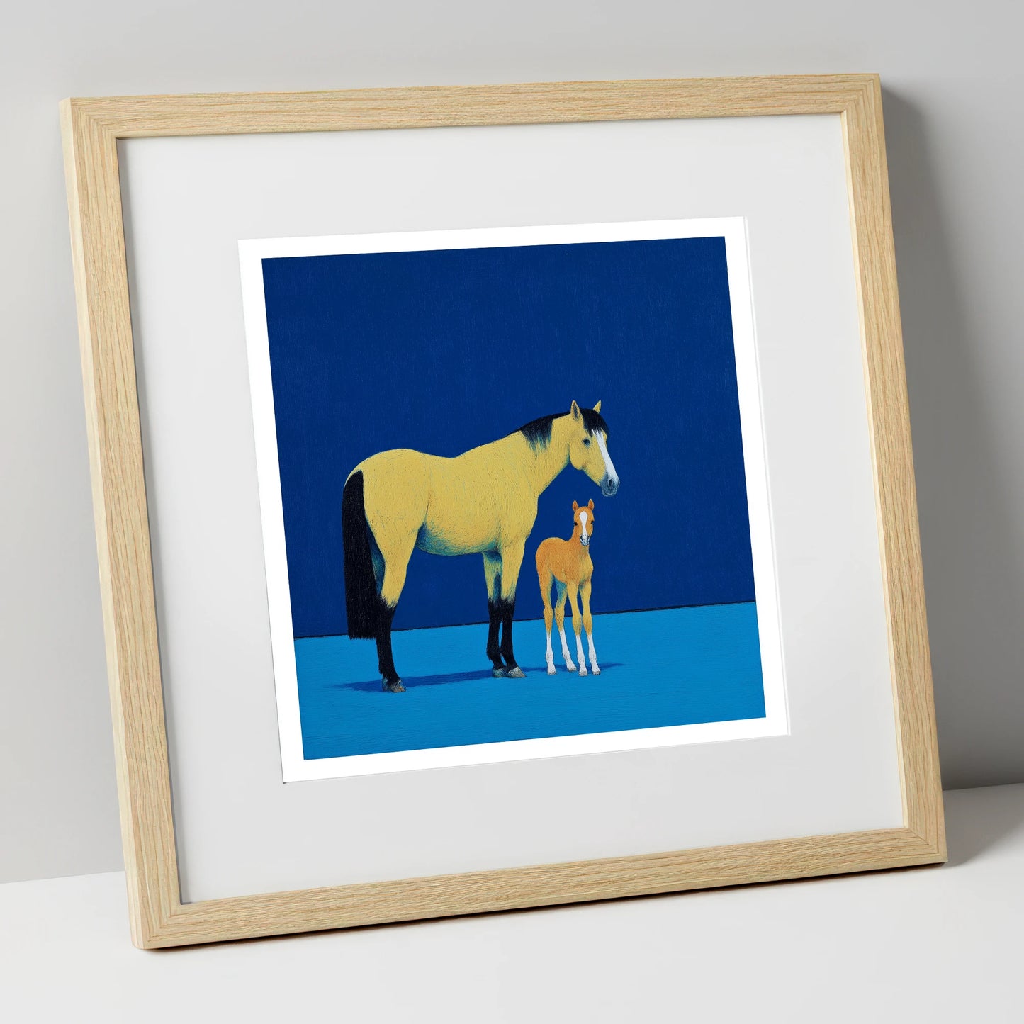 Striking Bonds in Blue mare & foal art print in natural frame
