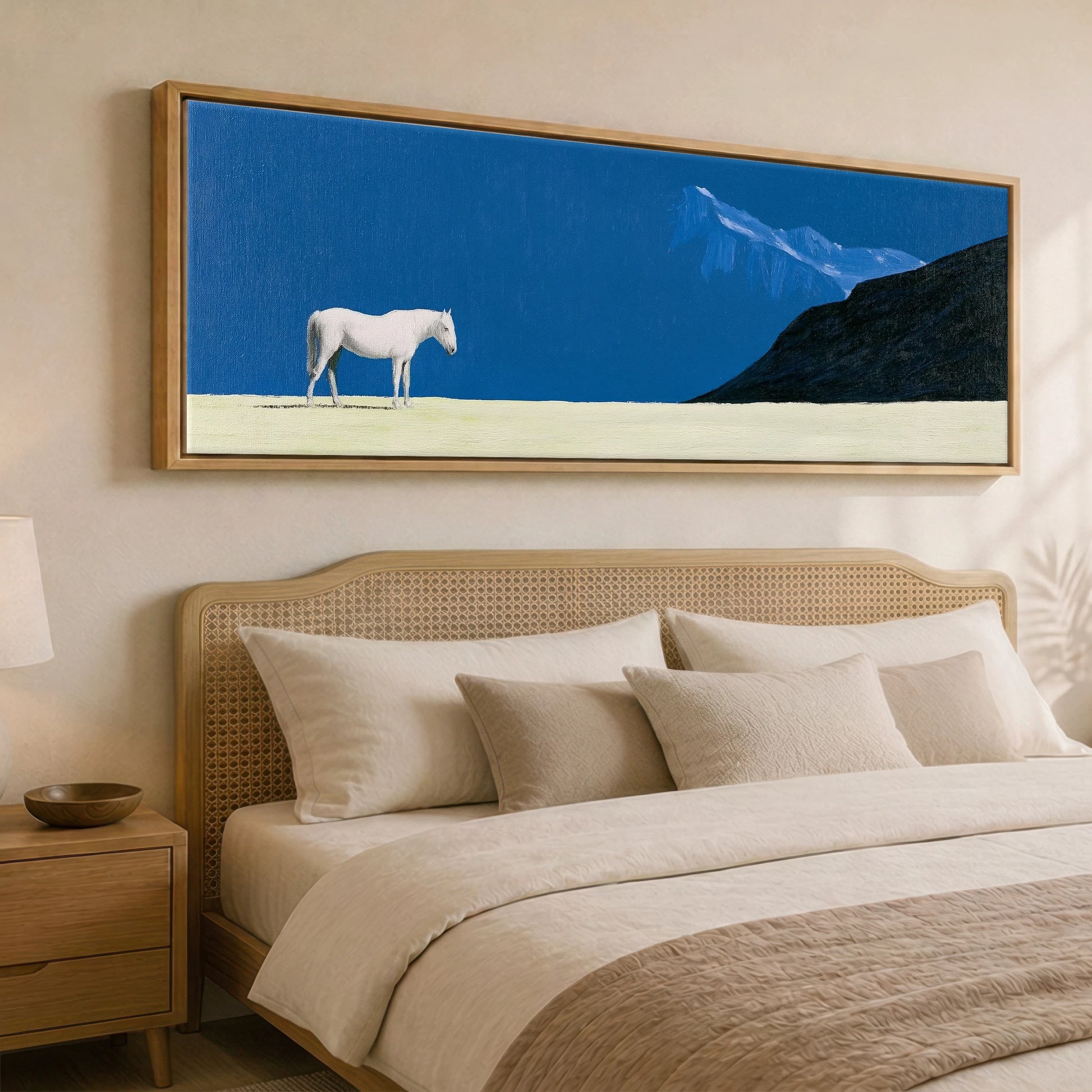 Solitude in Blue Horse Landscape panoramic canvas wall art displayed above a bed