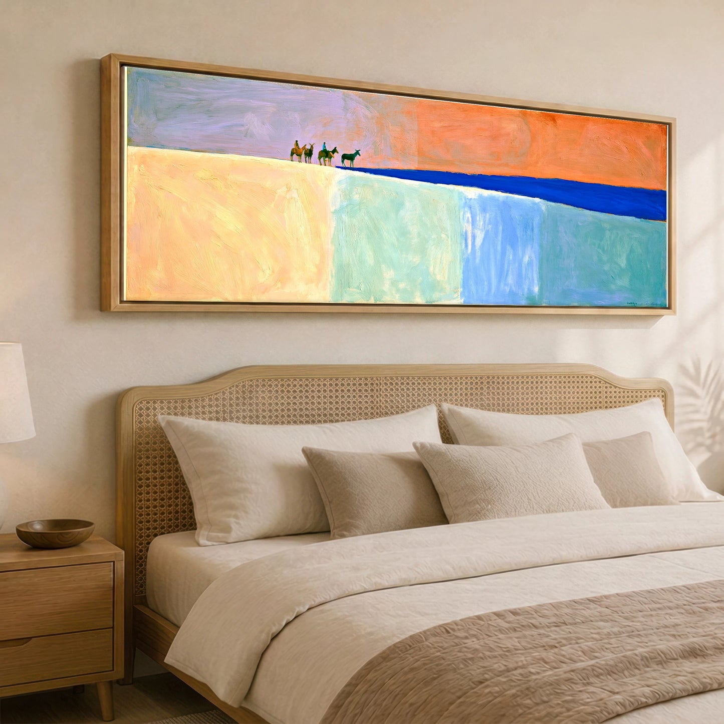 The Cobalt Horizon Horse & Rider panoramic canvas wall art displayed above a bed