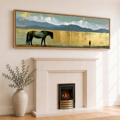 The Golden Expanse Horse Landscape panoramic canvas wall art displayed above a fireplace