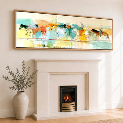 The Painted Trail Horse Landscape panoramic canvas wall art displayed above a fireplace