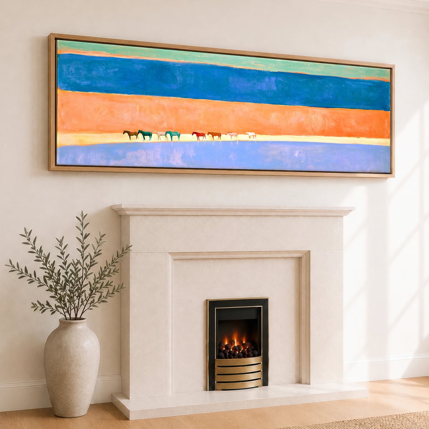 The Painted Horizon Wild Horses panoramic canvas wall art displayed above a fireplace
