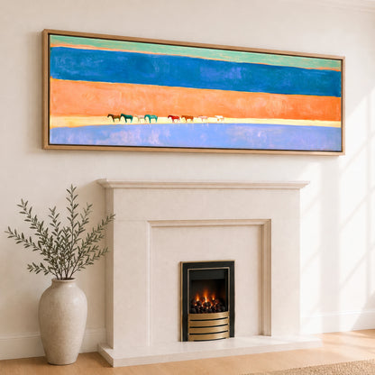 The Painted Horizon Wild Horses panoramic canvas wall art displayed above a fireplace