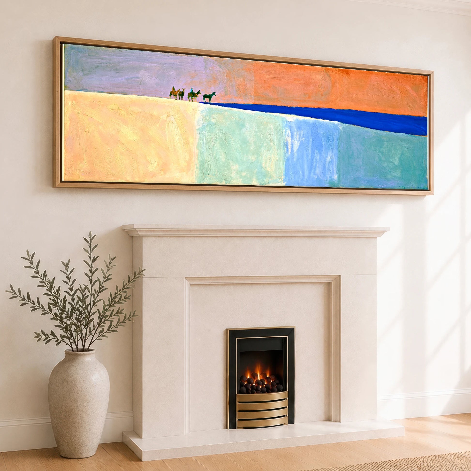 The Cobalt Horizon Horse & Rider panoramic canvas wall art displayed above a fireplace