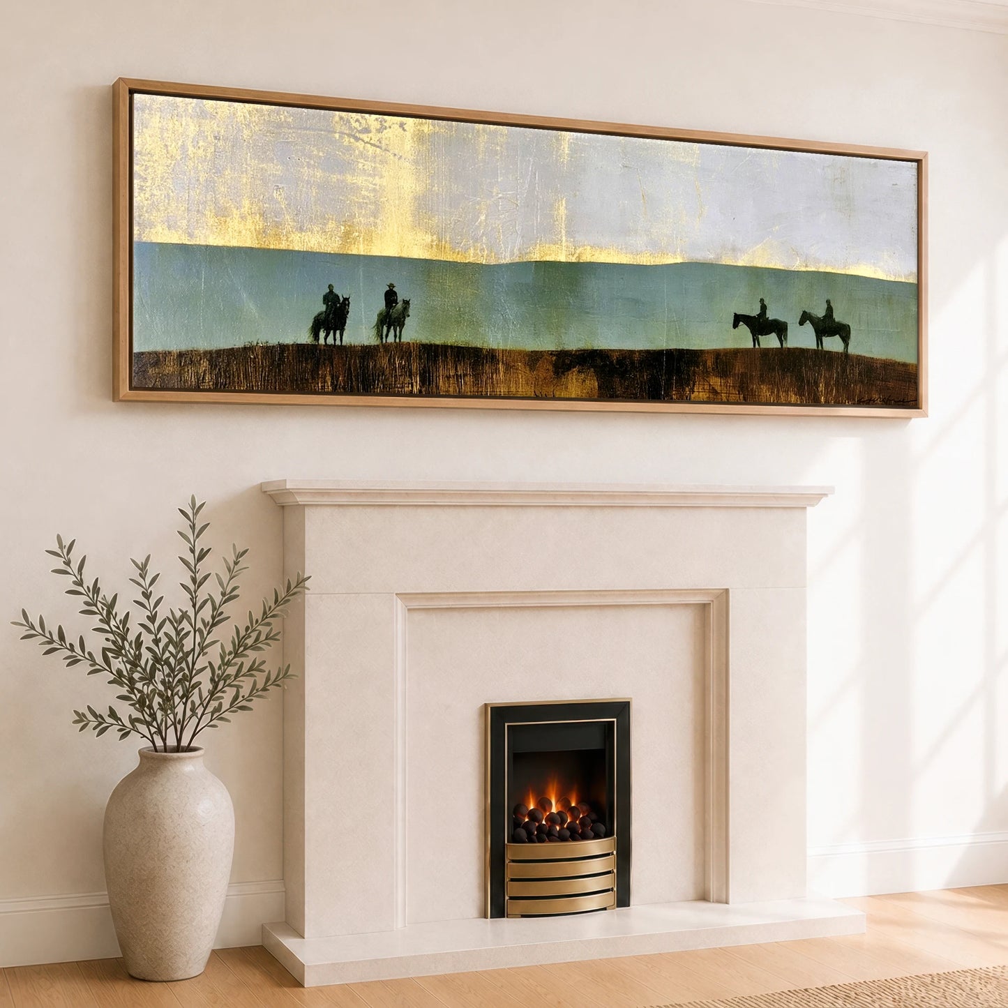 The Gilded Ridge Horse & Rider panoramic canvas wall art displayed above a fireplace