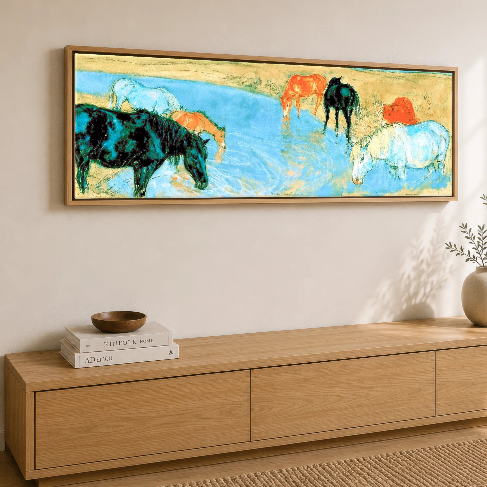 The Cerulean Stream Wild Horses panoramic canvas wall art displayed above a sideboard