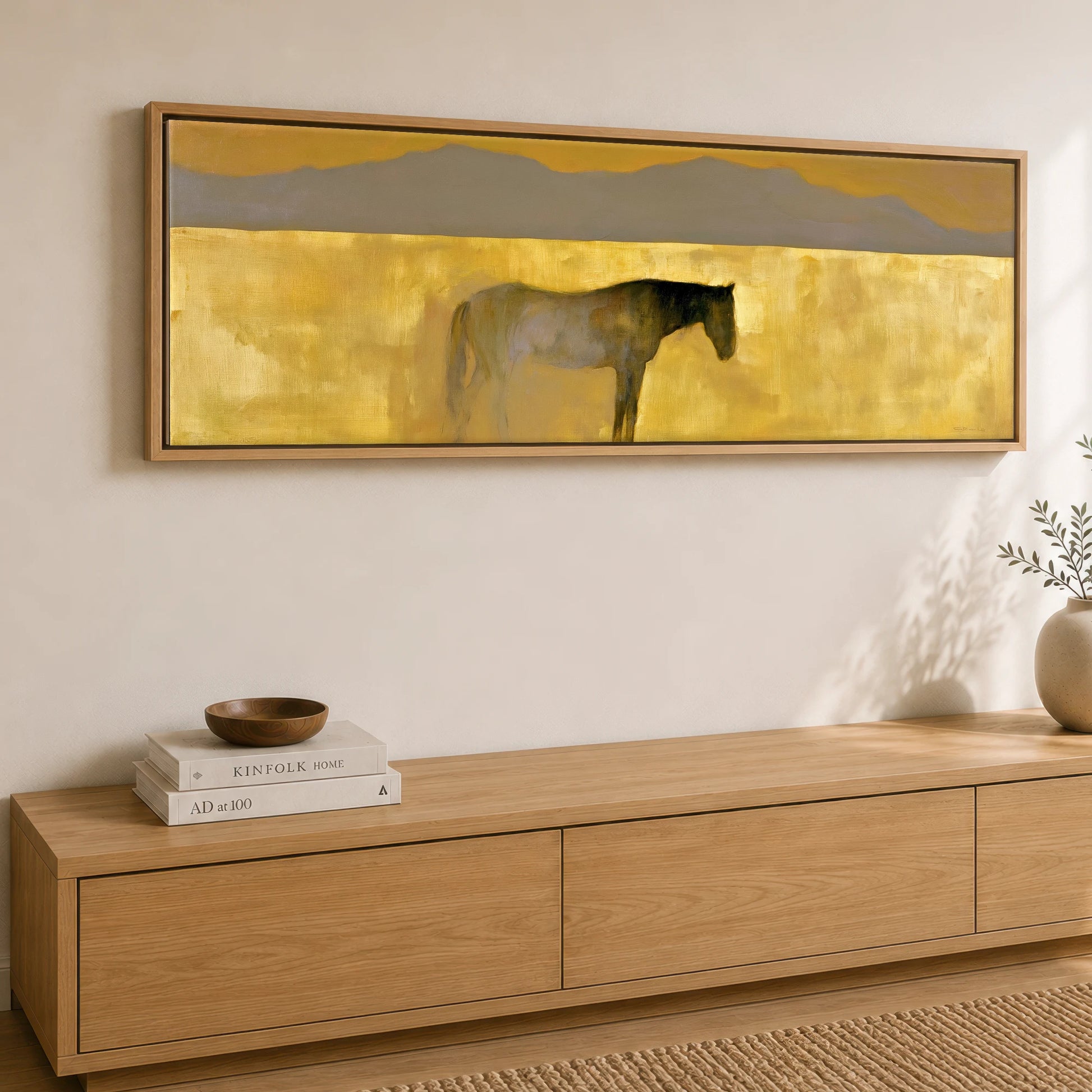 The Golden Expanse Horse Landscape panoramic canvas wall art displayed above a sideboard