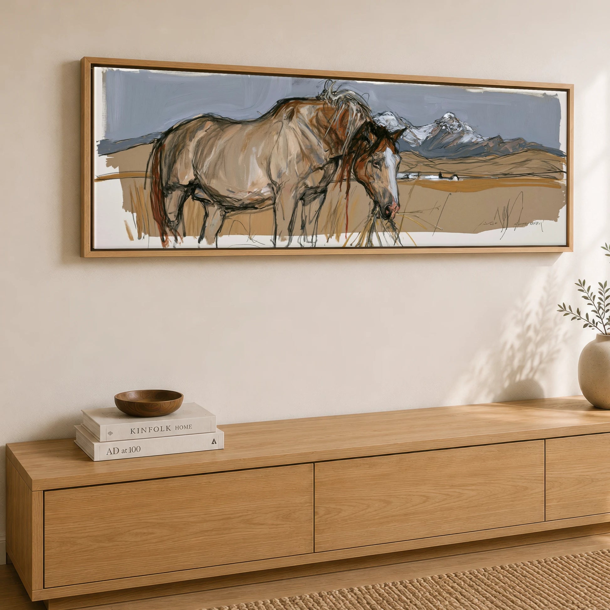 Grazing Below the Peaks Horse Landscape panoramic canvas wall art displayed above a sideboard