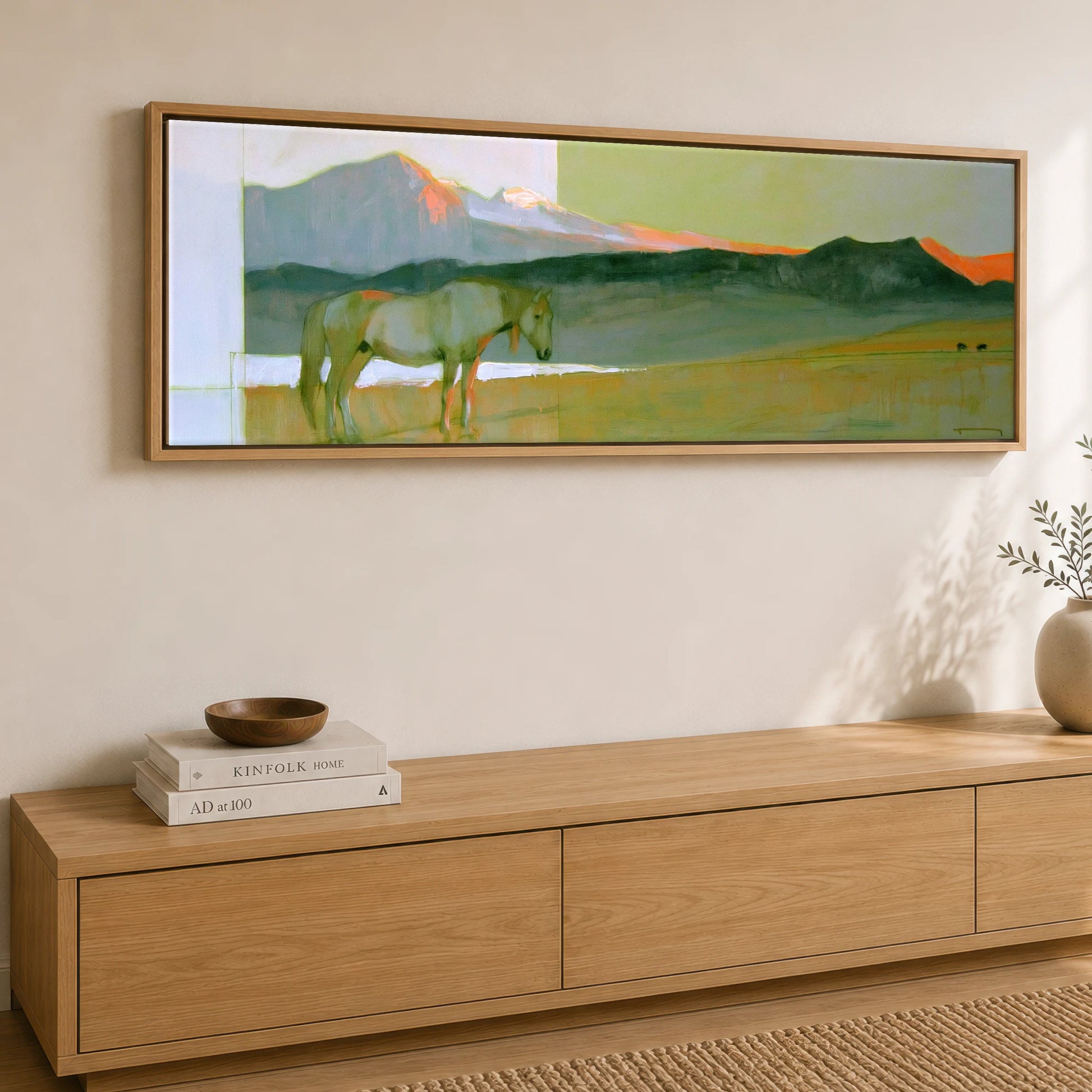 Pastel Mountain Light Horse Landscape panoramic canvas wall art displayed above a sideboard