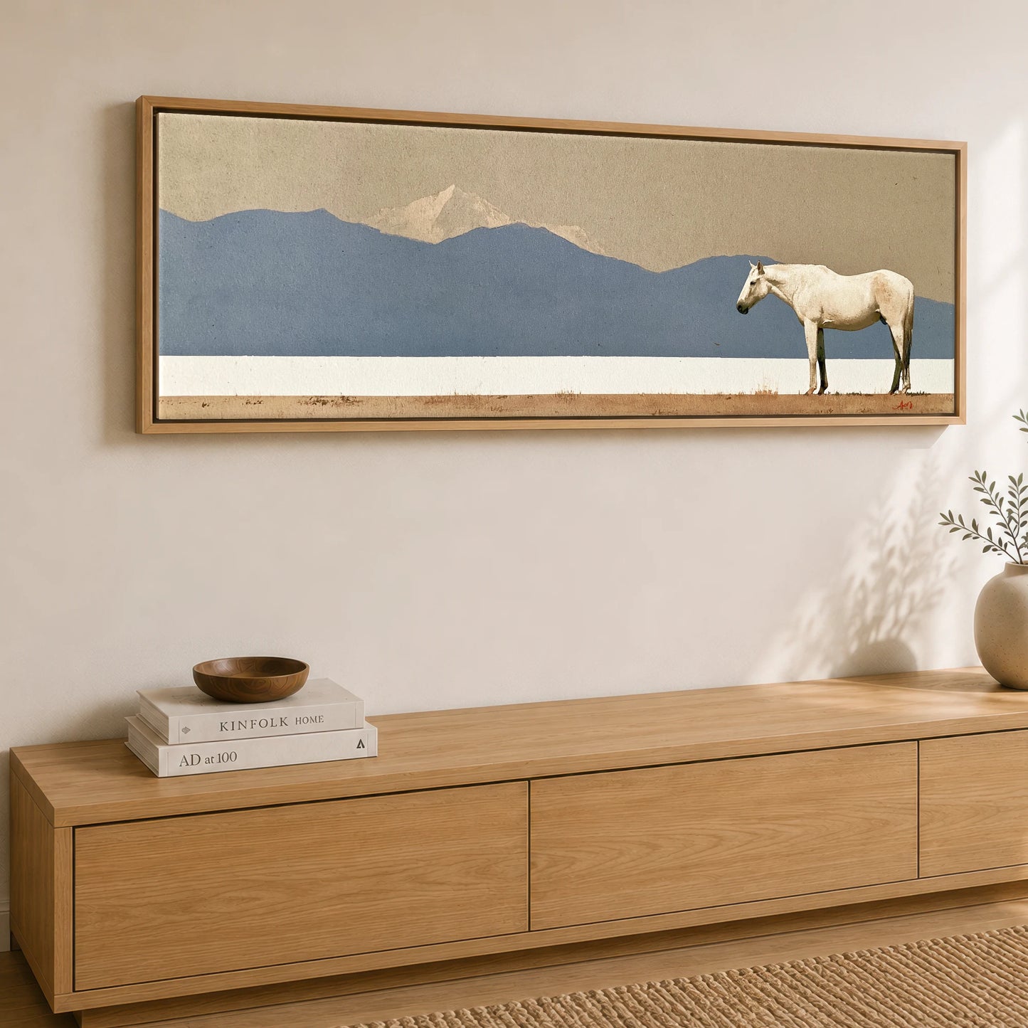 The Quiet Expanse Horse Landscape panoramic canvas wall art displayed above a sideboard