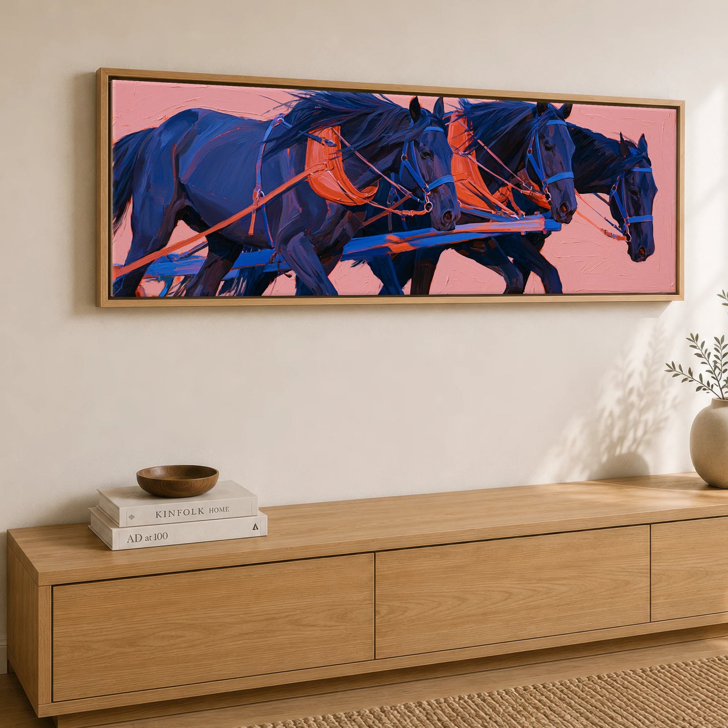 The Indigo Team Working Horse panoramic canvas wall art displayed above a sideboard