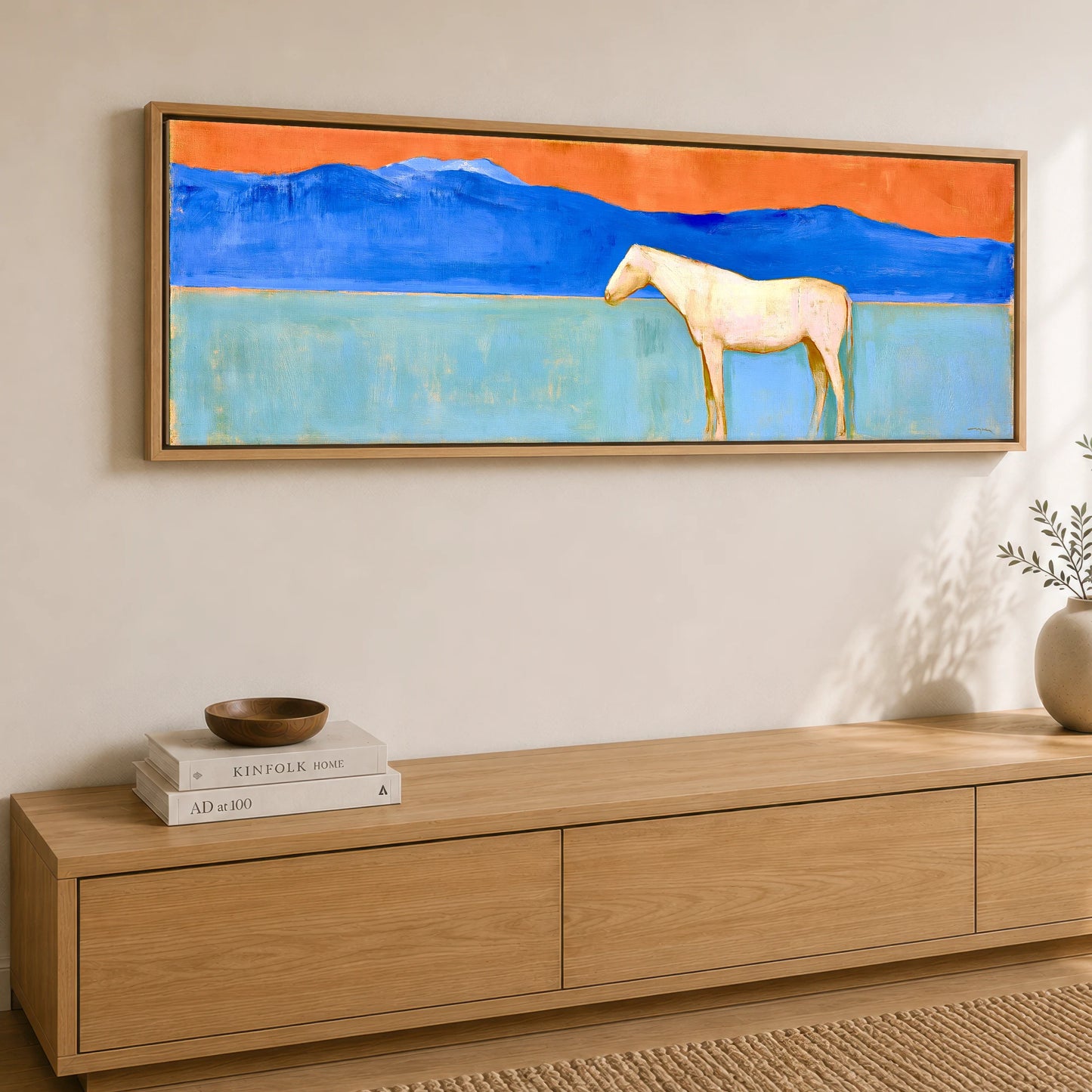 Terracotta Sky Solitude Horse Landscape panoramic canvas wall art displayed above a sideboard