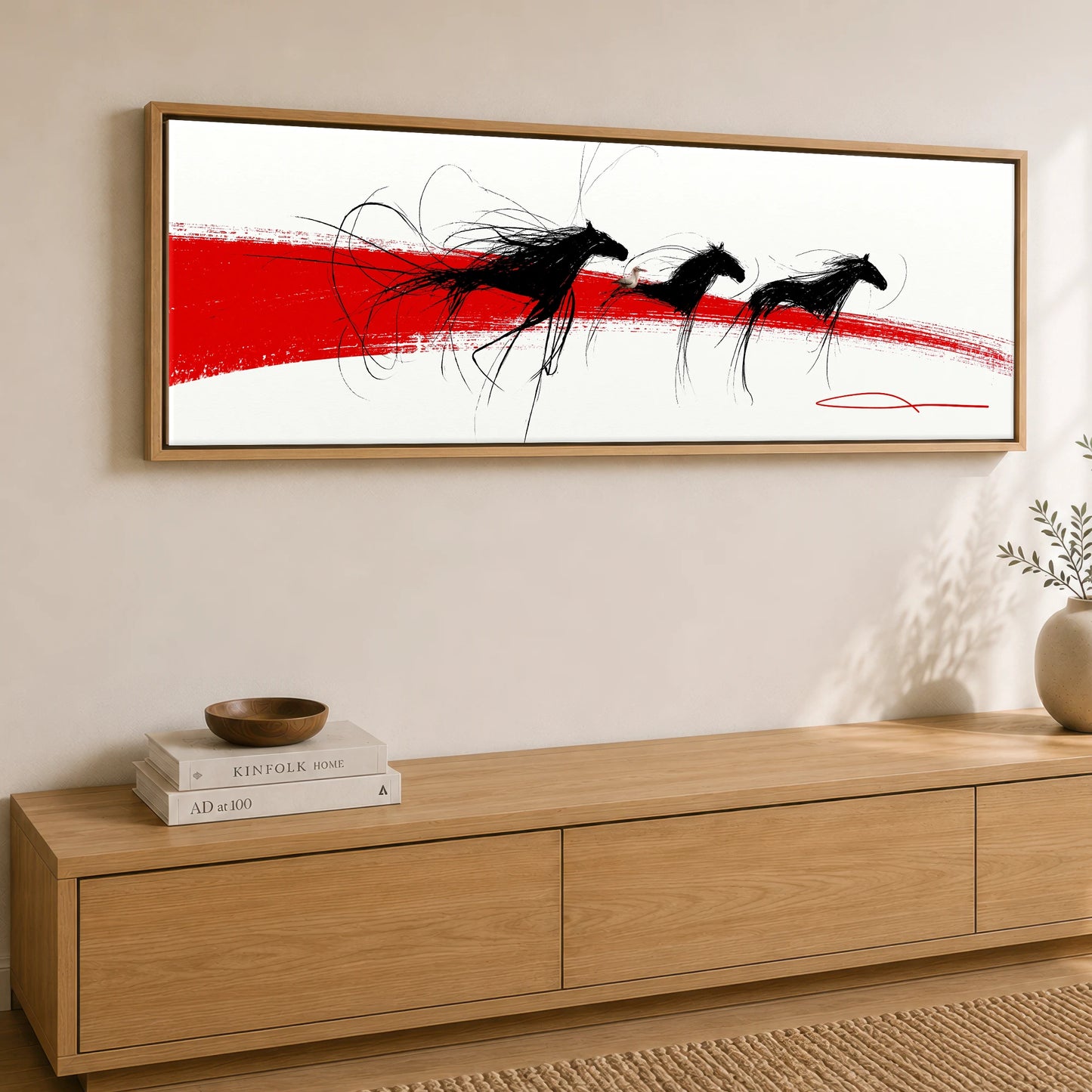 The Crimson Gallop Wild Horses panoramic canvas wall art displayed above a sideboard