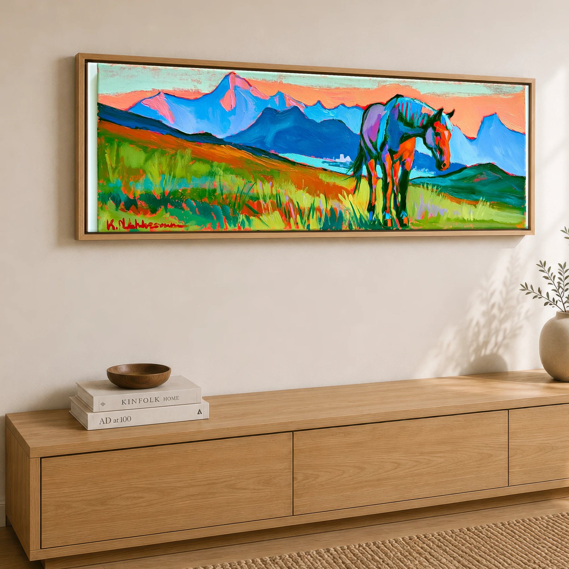 Technicolour Mountain Grazing Horse Landscape panoramic canvas wall art displayed above a sideboard