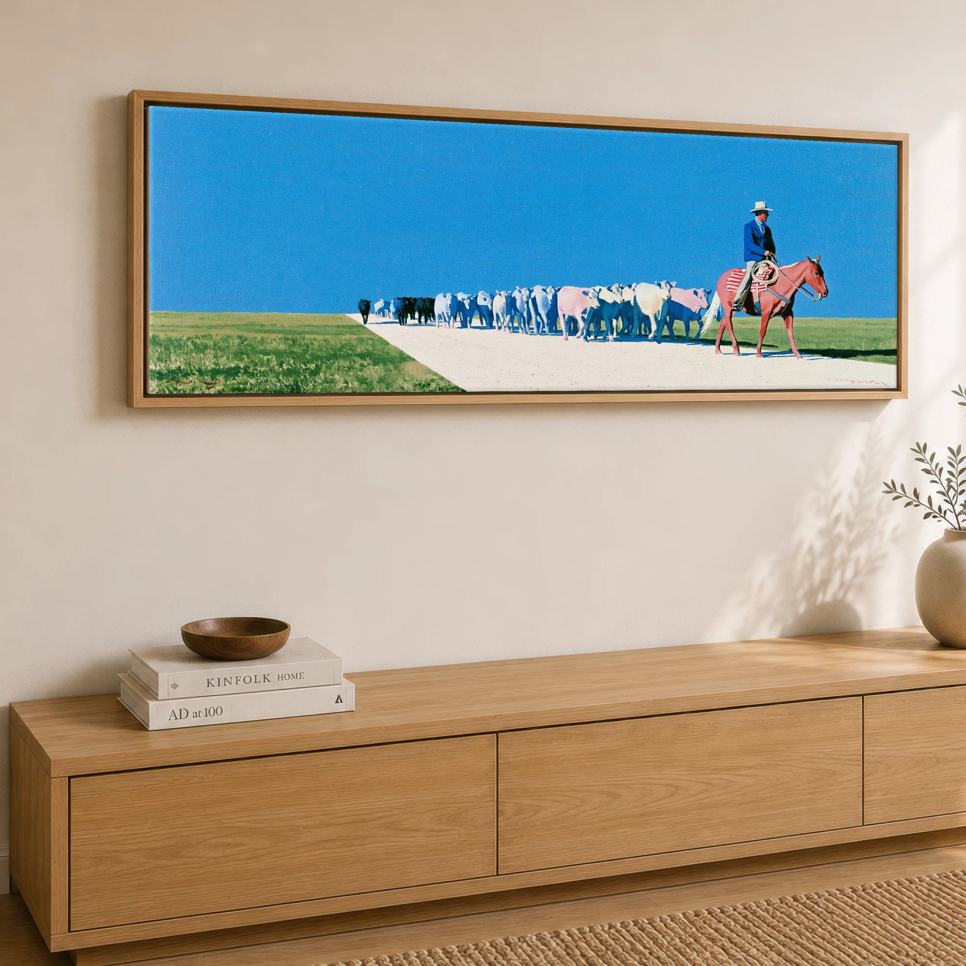 The Long Trail Western Horse panoramic canvas wall art displayed above a sideboard