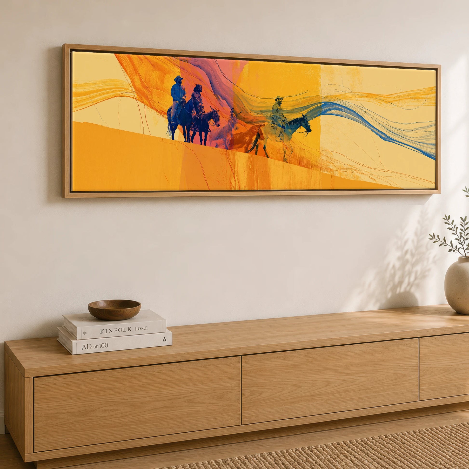 Riding the Horizon Horse & Rider panoramic canvas wall art displayed above a sideboard