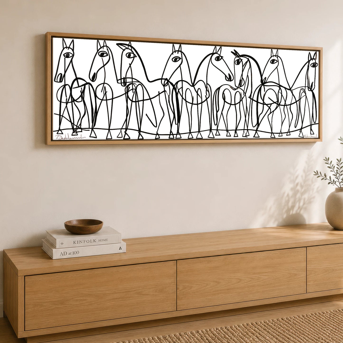 The Line Drawn Herd Horse Landscape panoramic canvas wall art displayed above a sideboard