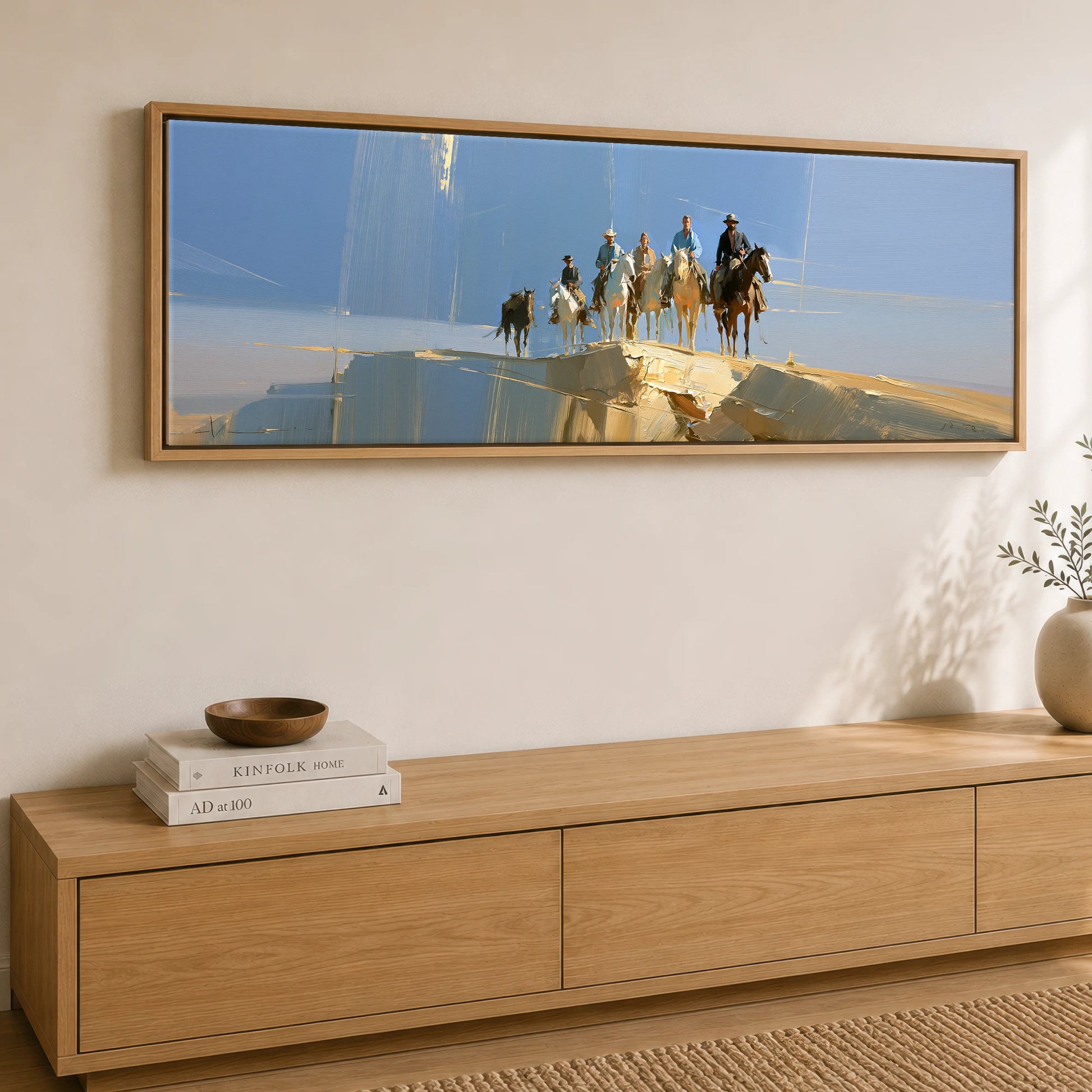 Cresting the Ridge Horse & Rider panoramic canvas wall art displayed above a sideboard