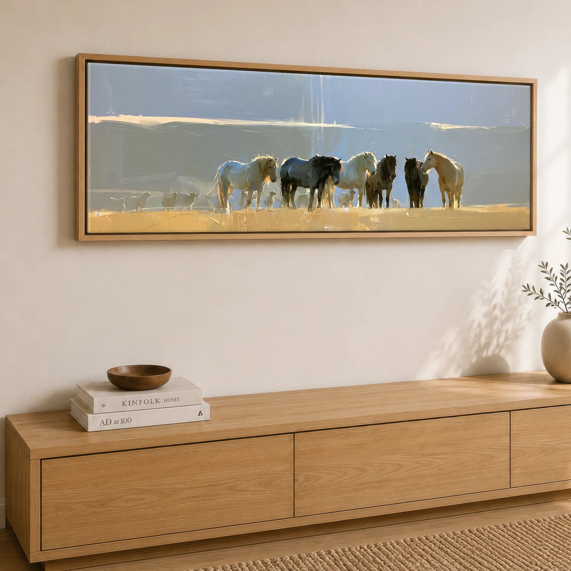 Sunlit Pasture Gathering Horse Landscape panoramic canvas wall art displayed above a sideboard