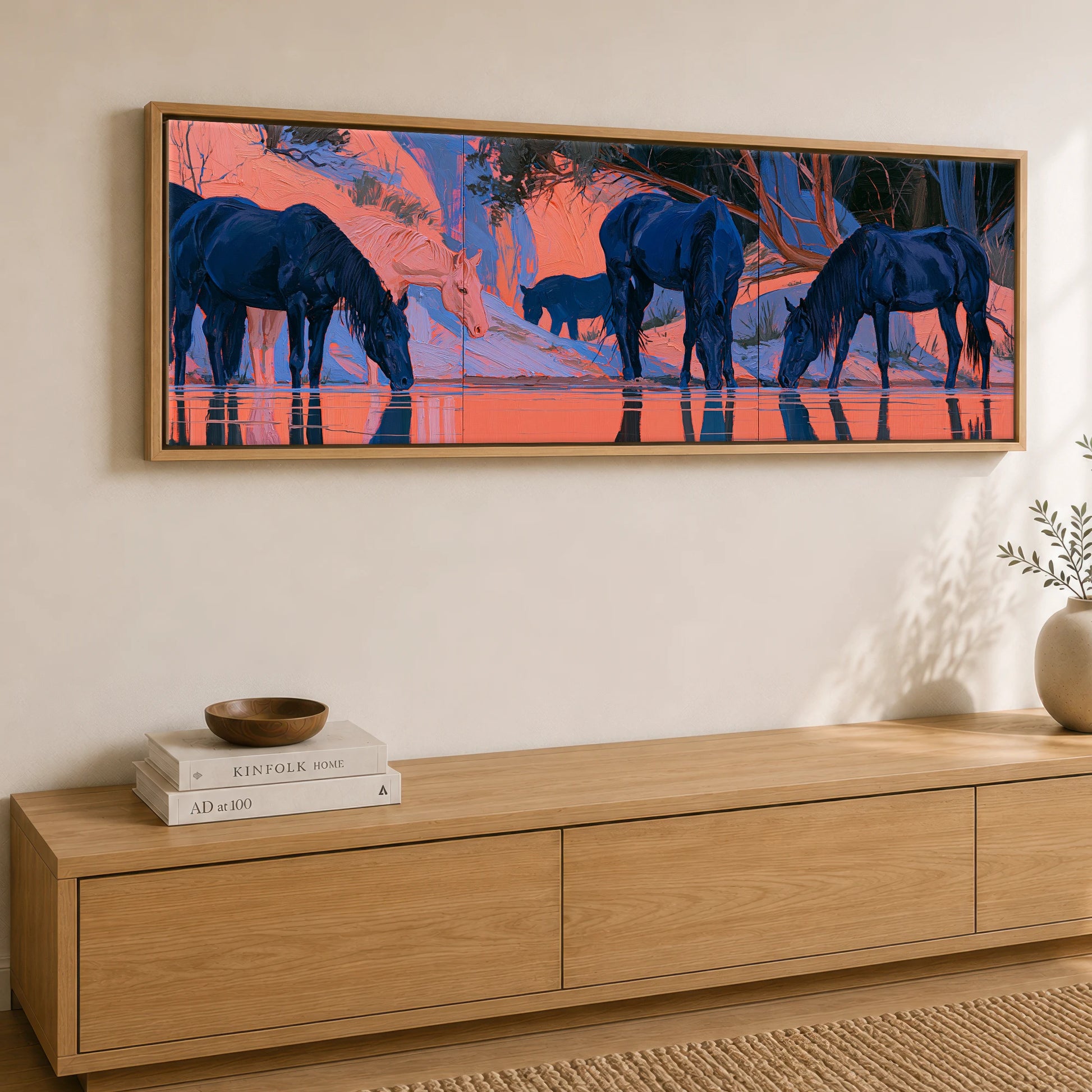 Indigo Herd in Winter Light Wild Horses panoramic canvas wall art displayed above a sideboard