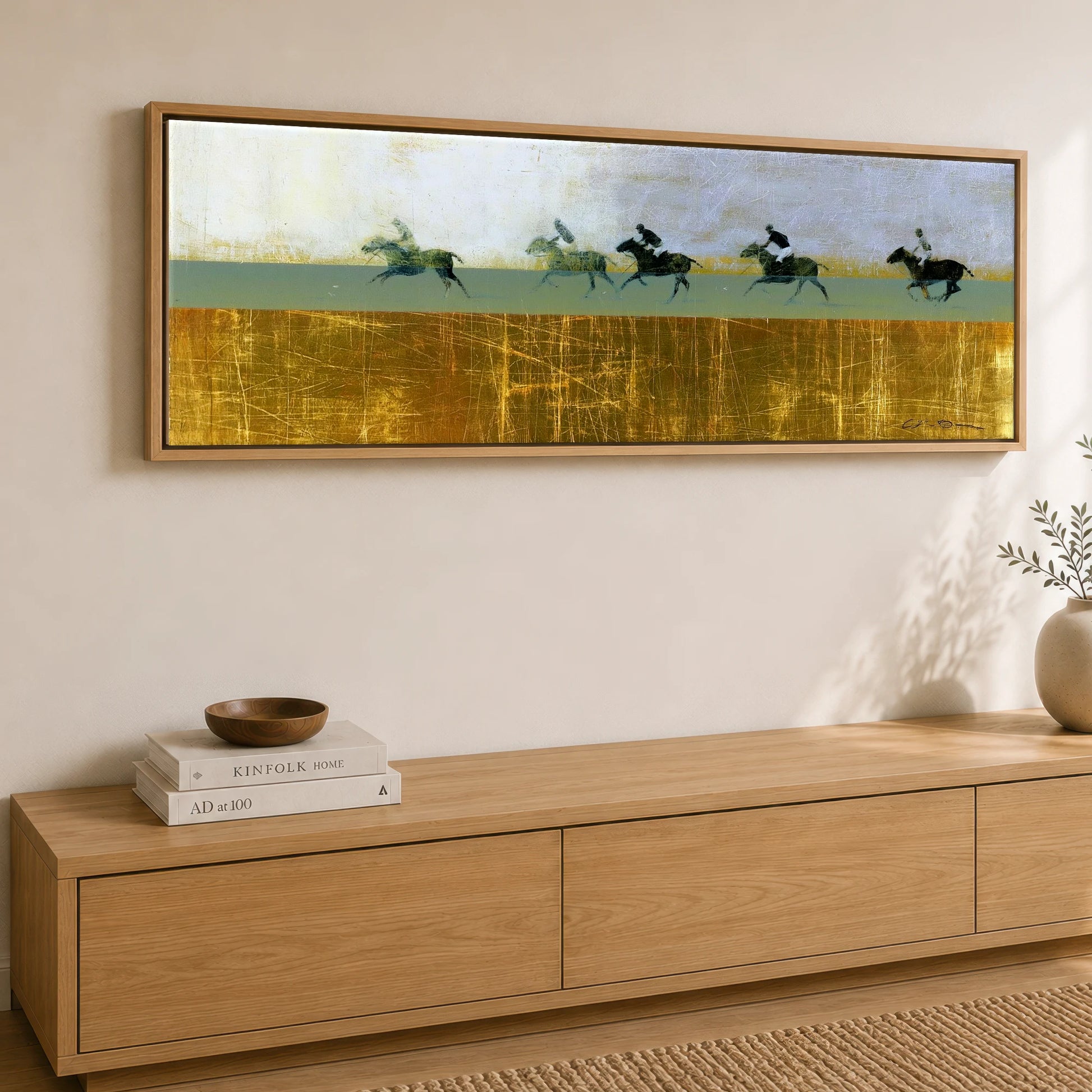 Pursuit in Gold Polo Horse panoramic canvas wall art displayed above a sideboard