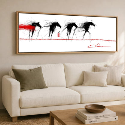 The Crimson Line Wild Horses panoramic canvas wall art displayed above a sofa