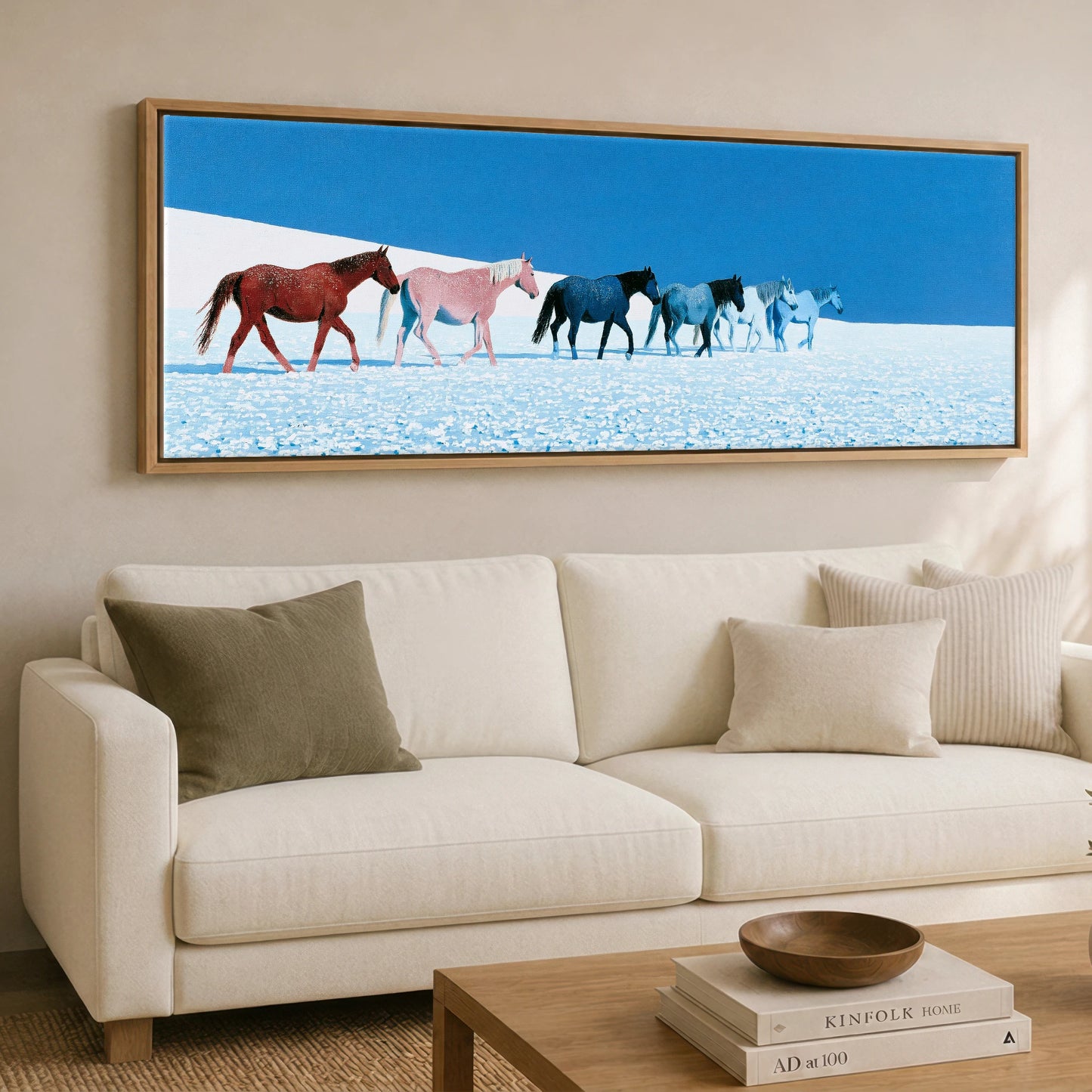 The Azure Procession Horse Landscape panoramic canvas wall art displayed above a sofa