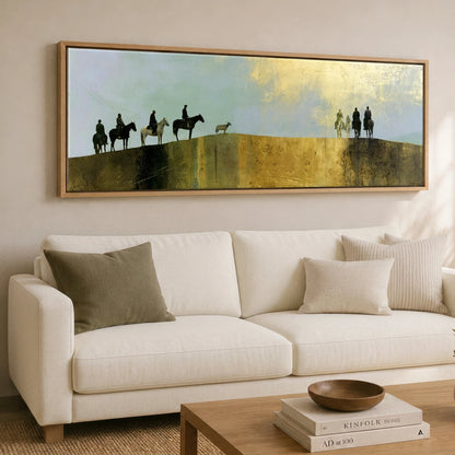 The Golden Ridge Horse & Rider panoramic canvas wall art displayed above a sofa