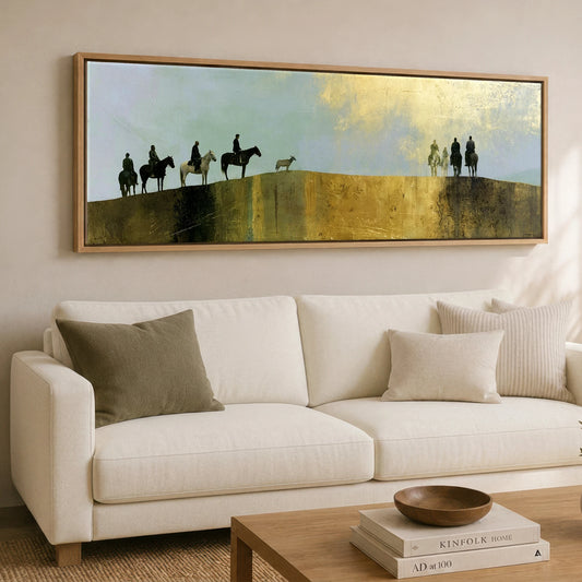 The Golden Ridge Horse & Rider panoramic canvas wall art displayed above a sofa