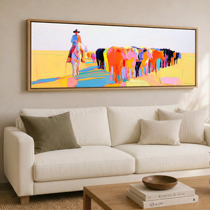 Vibrant Cattle Drive Western Horse panoramic canvas wall art displayed above a sofa
