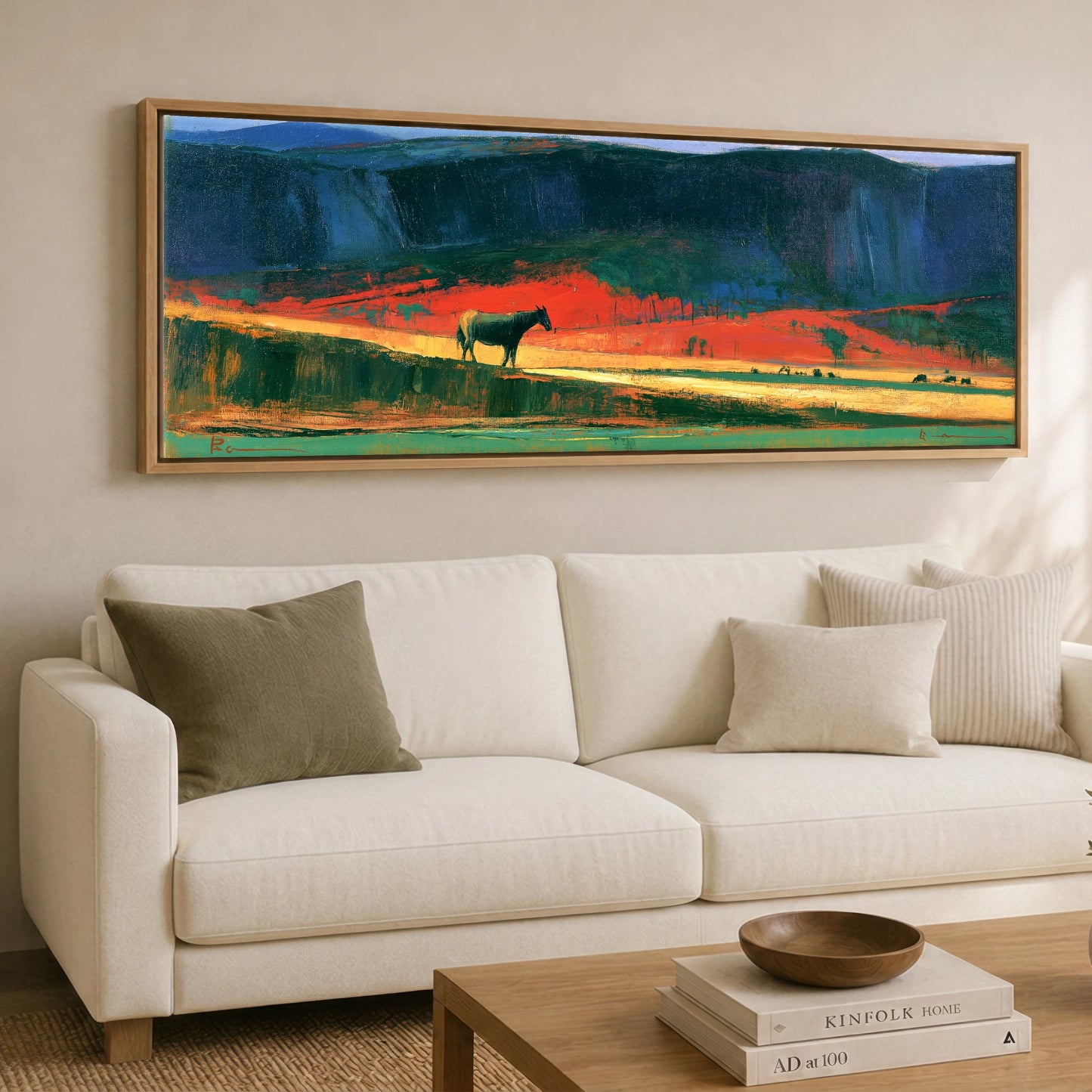 The Crimson Ridge Horse Landscape panoramic canvas wall art displayed above a sofa