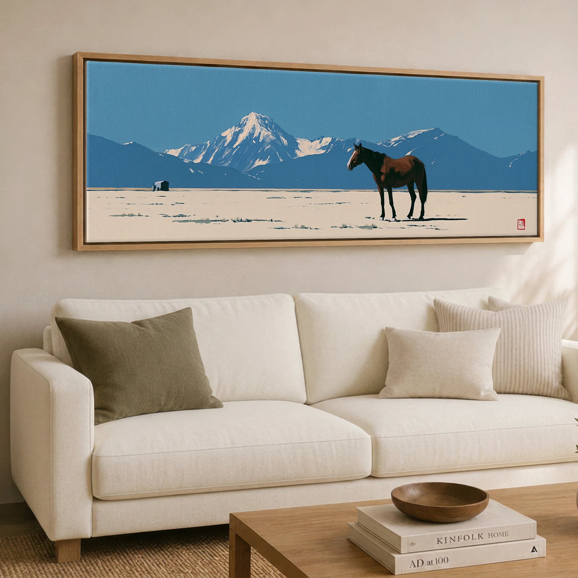 The Vast Horizon Horse Landscape panoramic canvas wall art displayed above a sofa