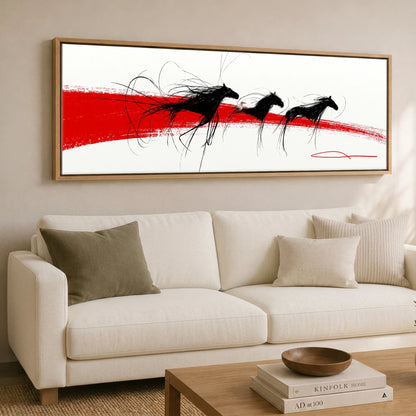 The Crimson Gallop Wild Horses panoramic canvas wall art displayed above a sofa