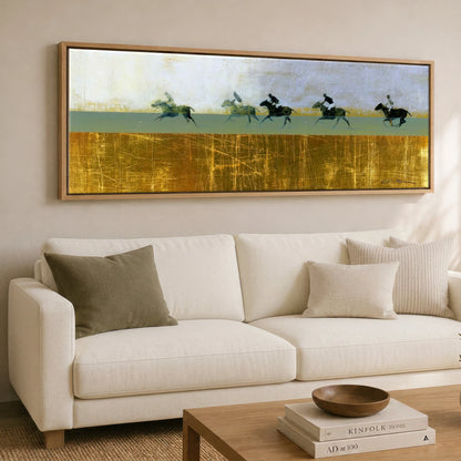 Pursuit in Gold Polo Horse panoramic canvas wall art displayed above a sofa