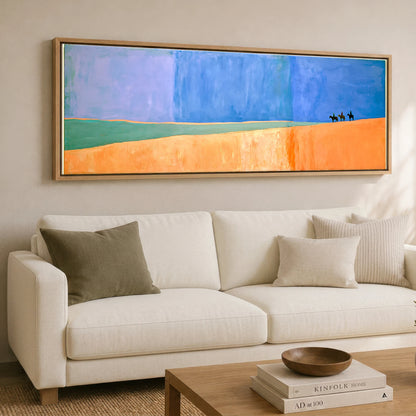 Vast Blue Horizons Horse & Rider panoramic canvas wall art displayed above a sofa