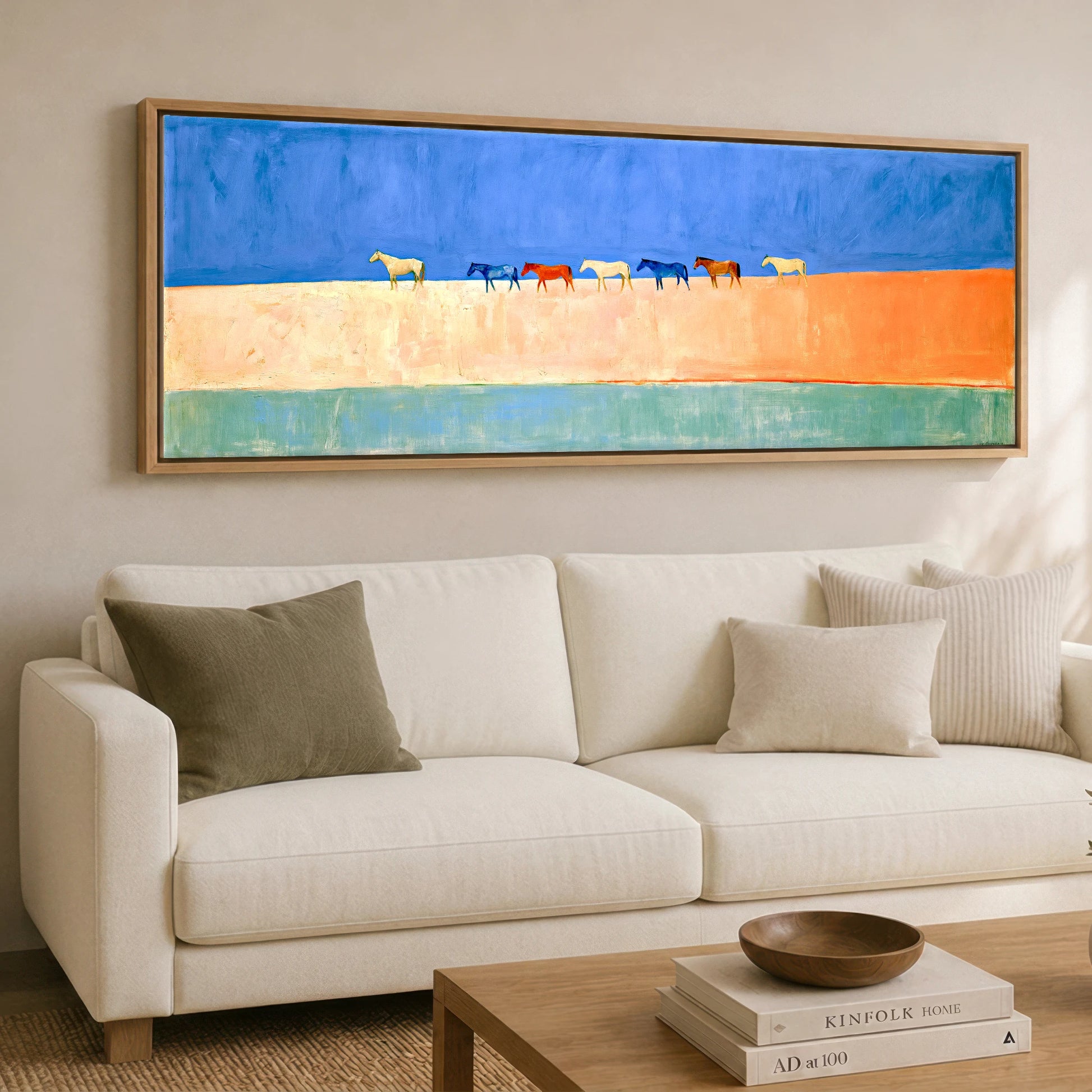 Nomads of the Horizon Wild Horses panoramic canvas wall art displayed above a sofa