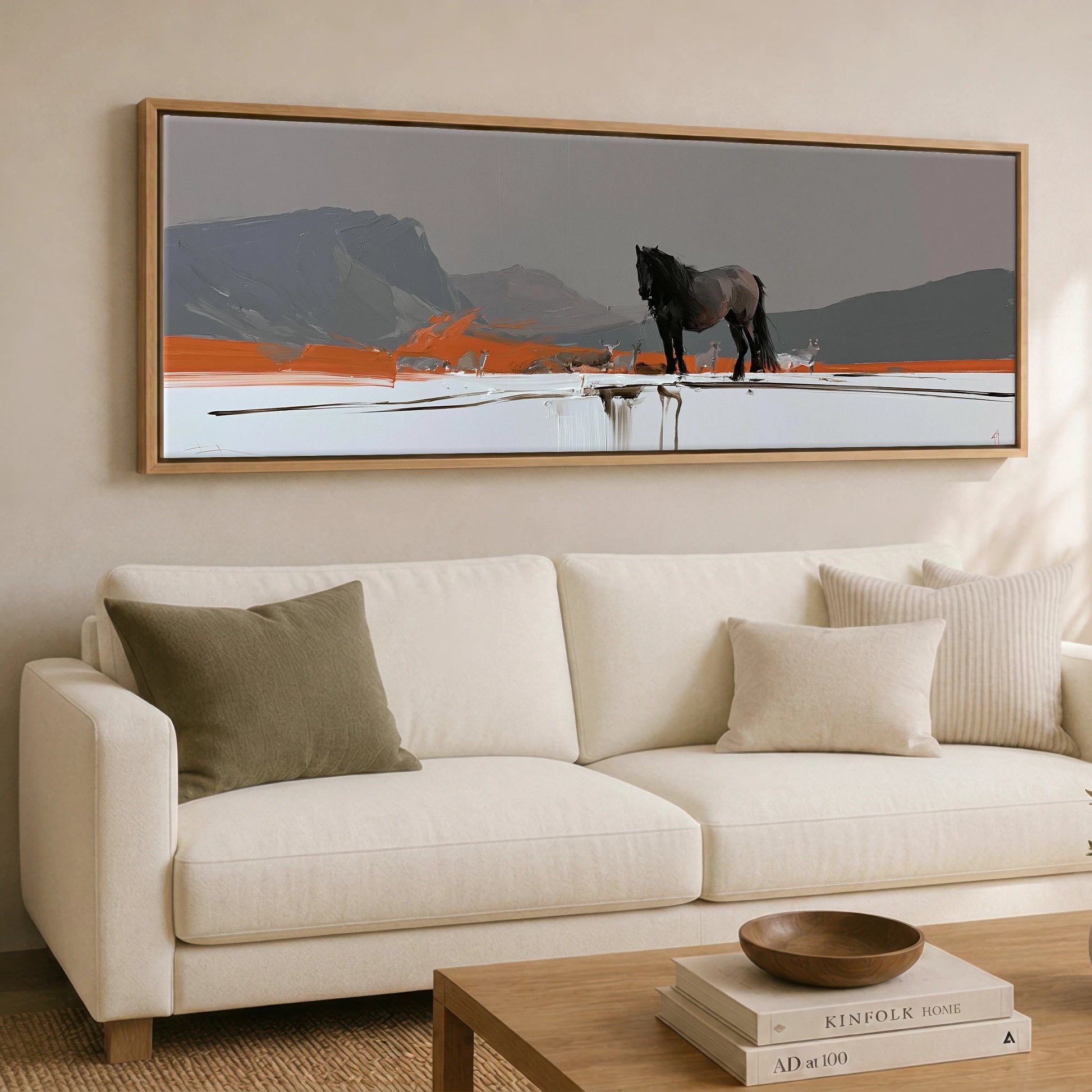 The Vivid Expanse Horse Landscape panoramic canvas wall art displayed above a sofa