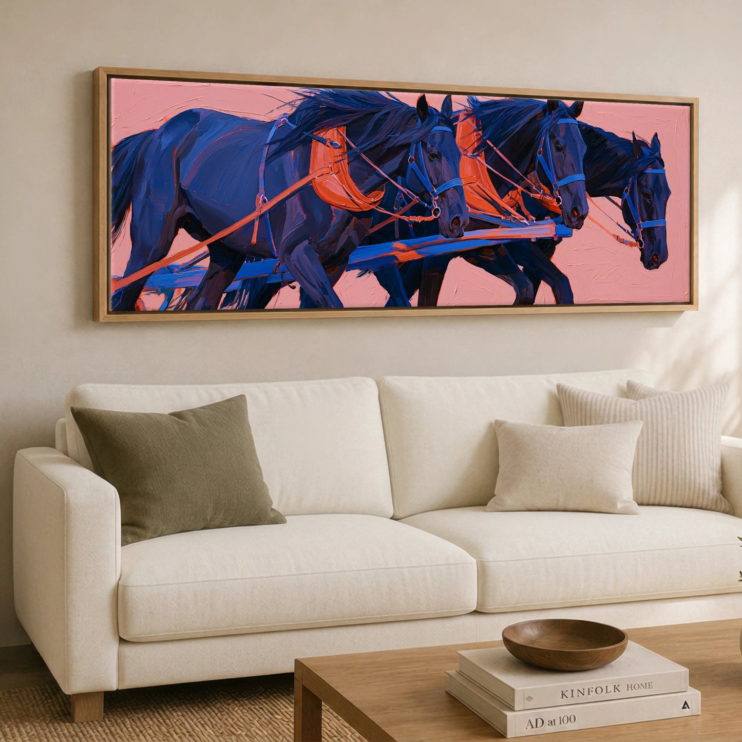 The Indigo Team Working Horse panoramic canvas wall art displayed above a sofa