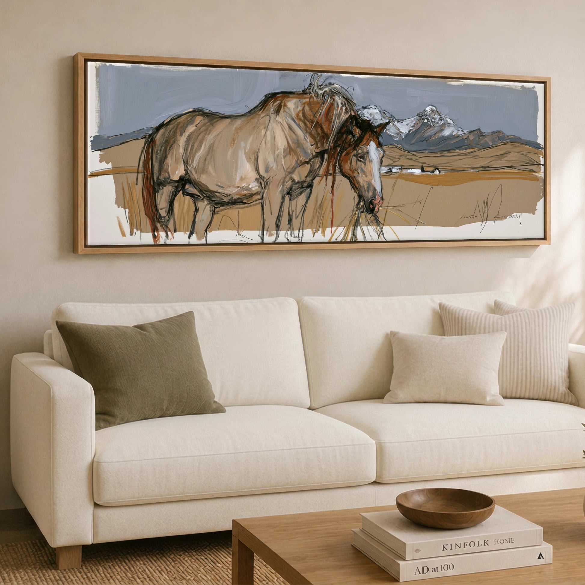 Grazing Below the Peaks Horse Landscape panoramic canvas wall art displayed above a sofa
