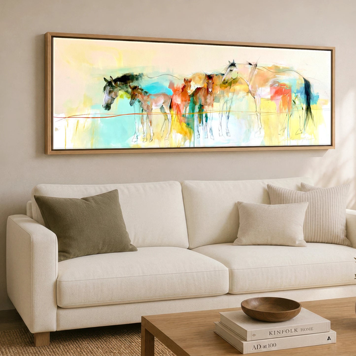 Vibrant Spring Herd Mare & Foal panoramic canvas wall art displayed above a sofa